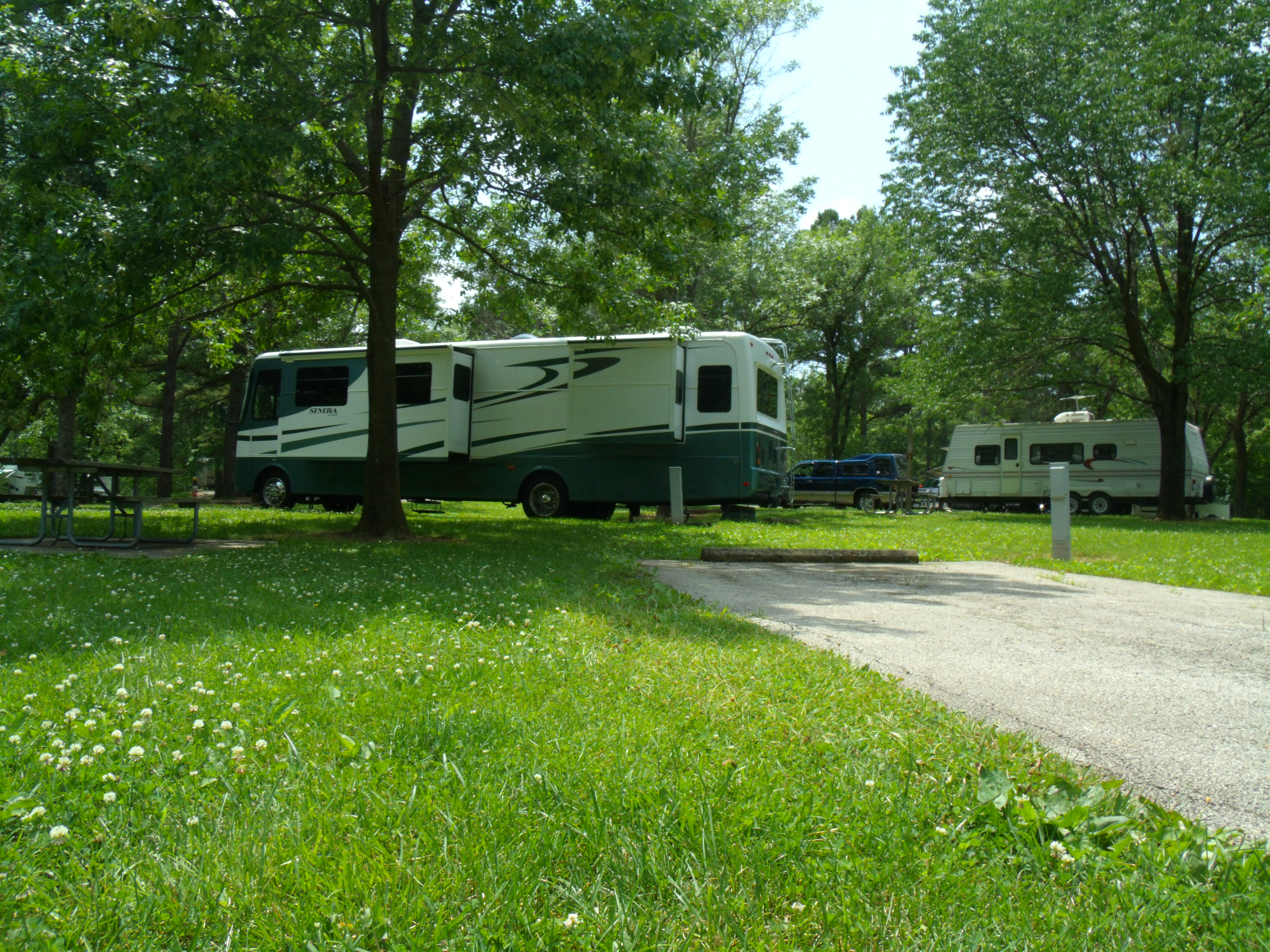 an RV parked in a lot at Crowder State Park