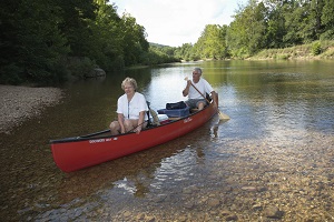 two people floating in a canoe