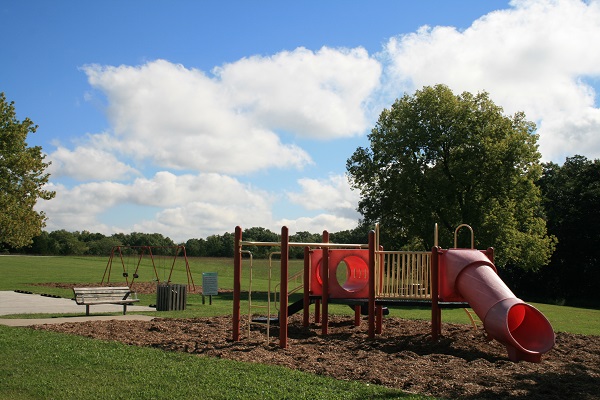 plagyground equipment with slides and a swing set