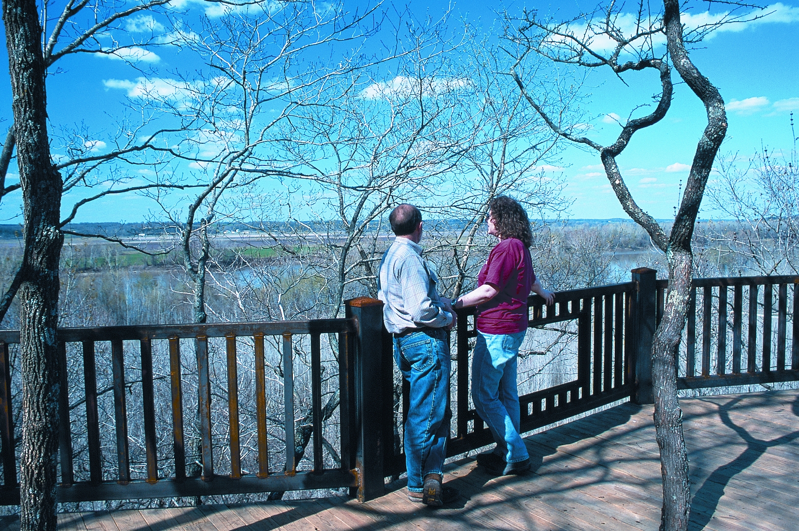 a couple looking at the view of the river from the overlook 