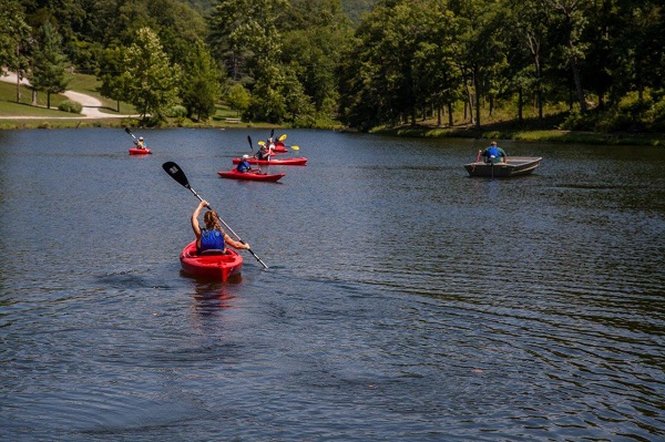 people kayaking on the lake