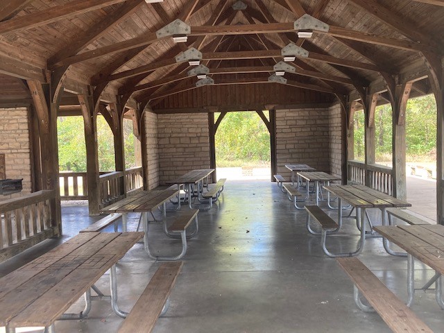 Picnic tables inside the open shelter