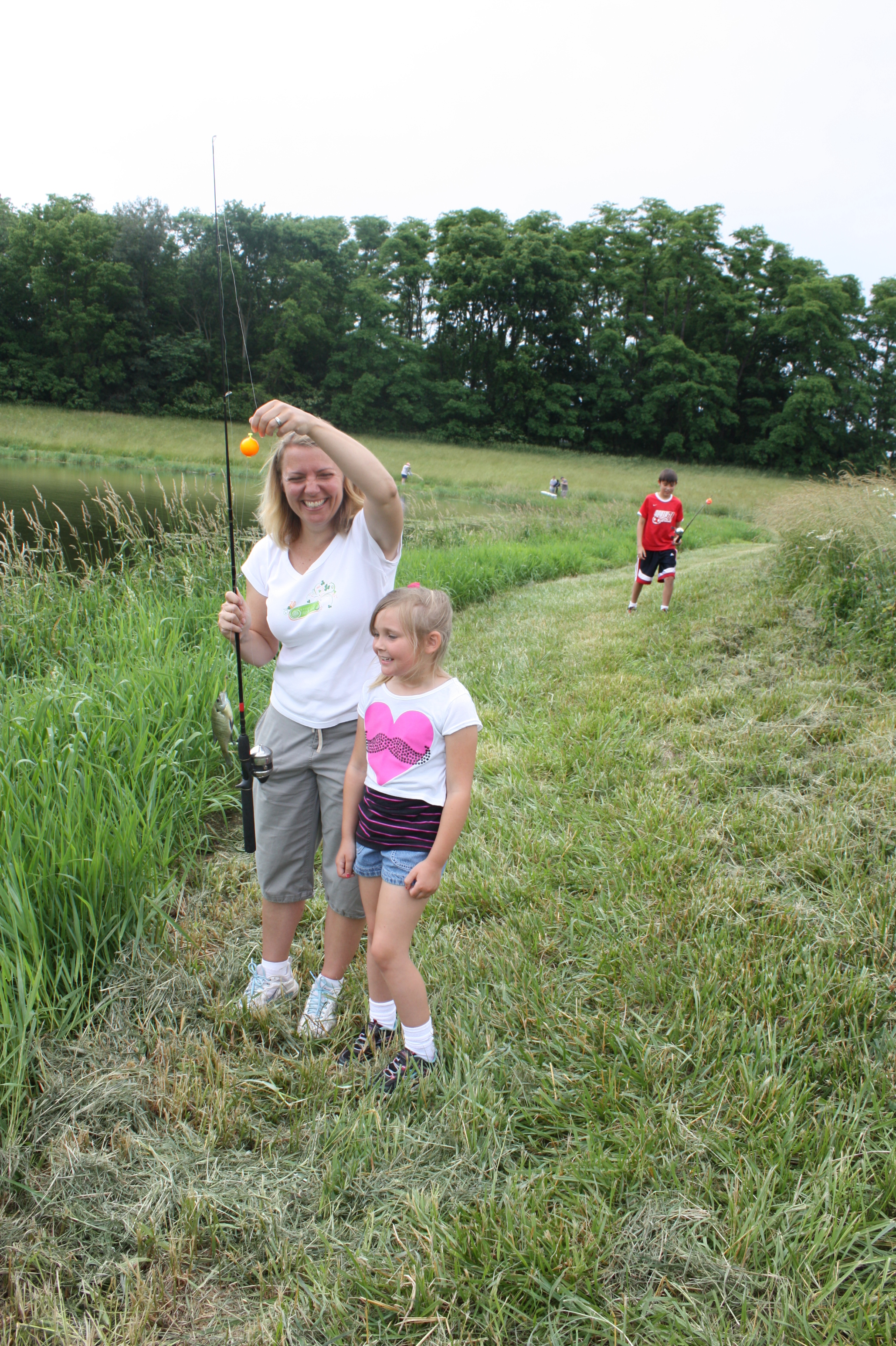 a woman and small girl getting ready to fish