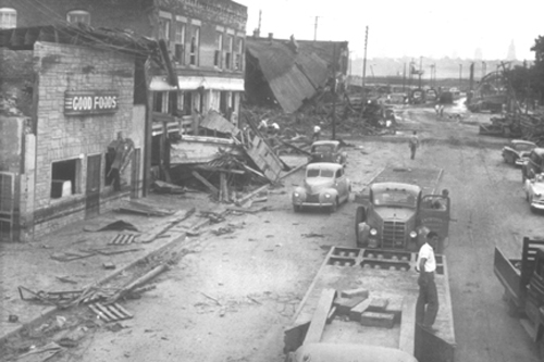 buildings falling and other damage on Kansas Avenue and Berger