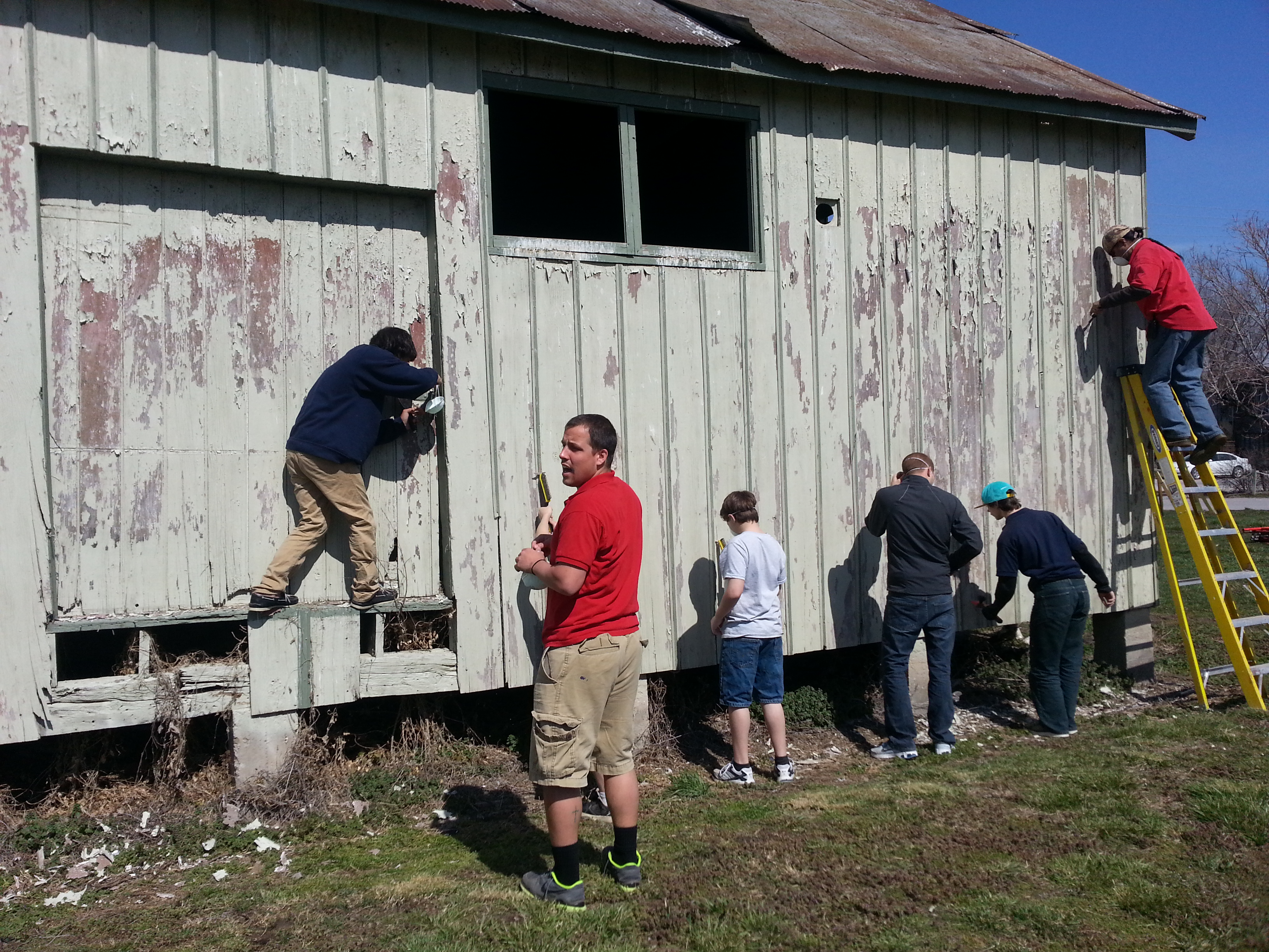 a group painting a building