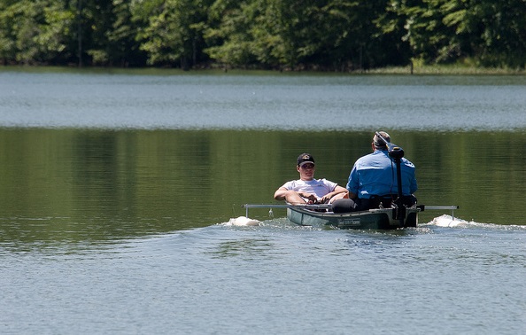two people in a boat on the lake