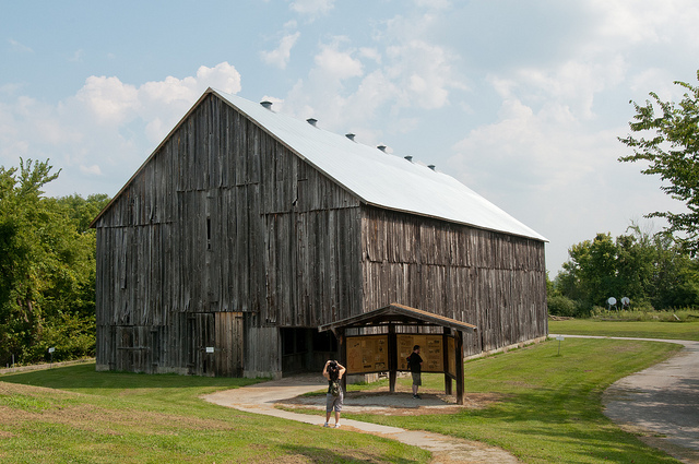 a large, wooden tobacco barn