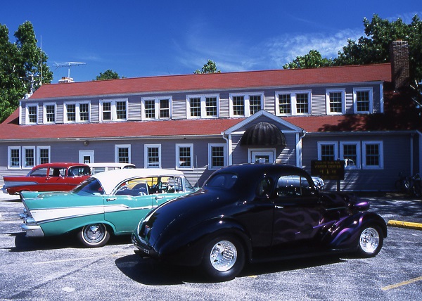 vintage cars parked in front of the visitor center