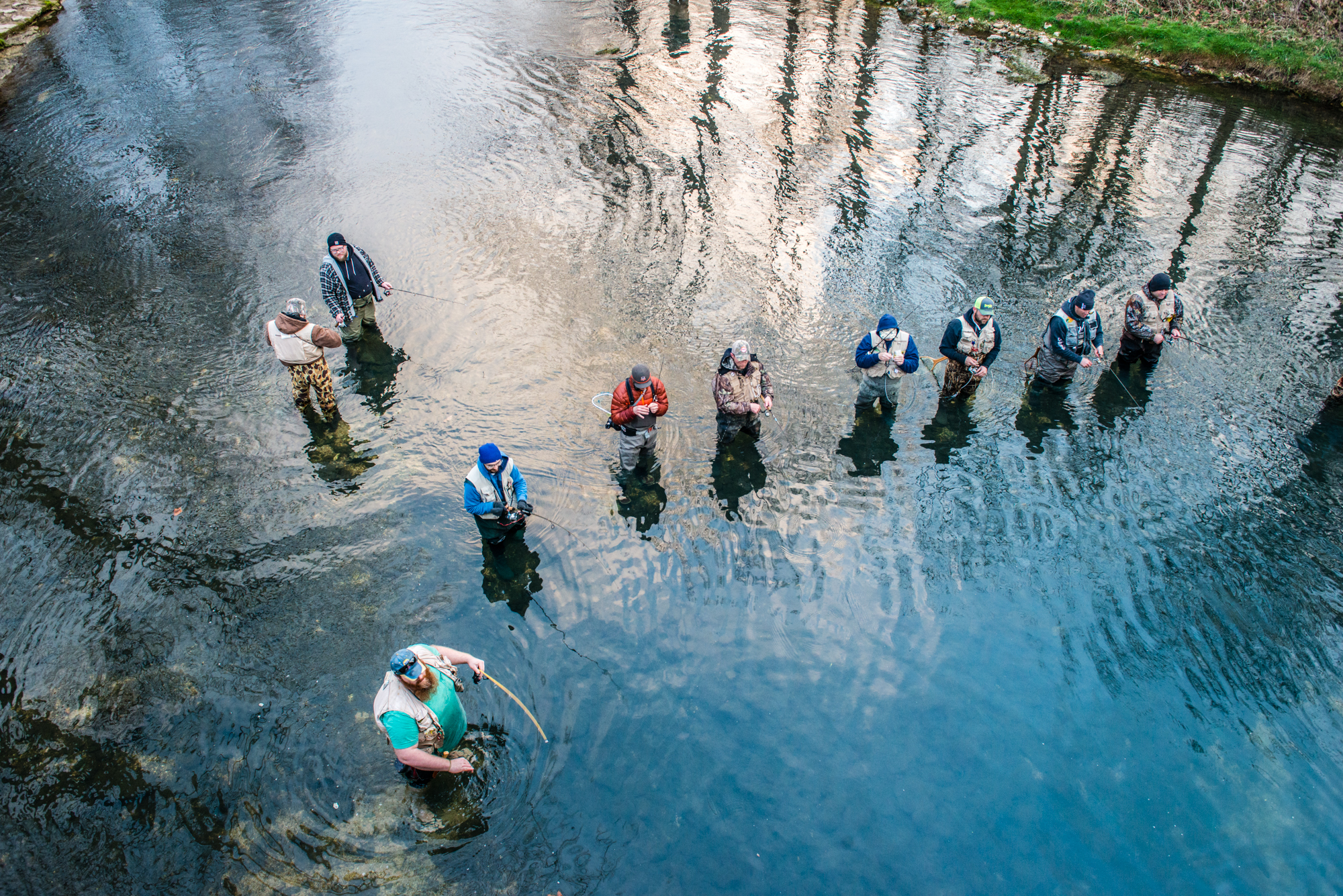 People fly-fishing in the river at Bennett Spring State Park