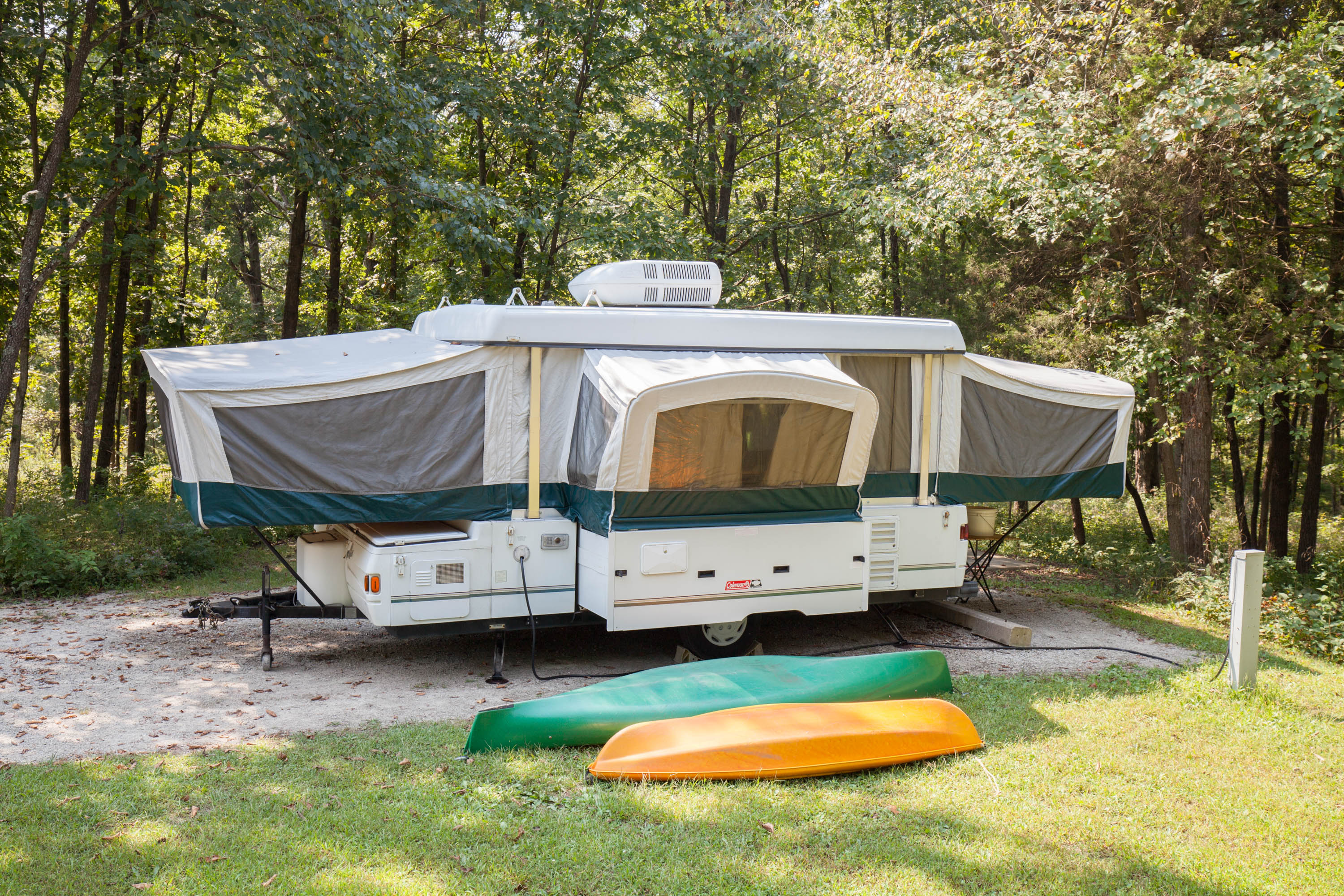 an RV camper at a campsite at Park Cuivre