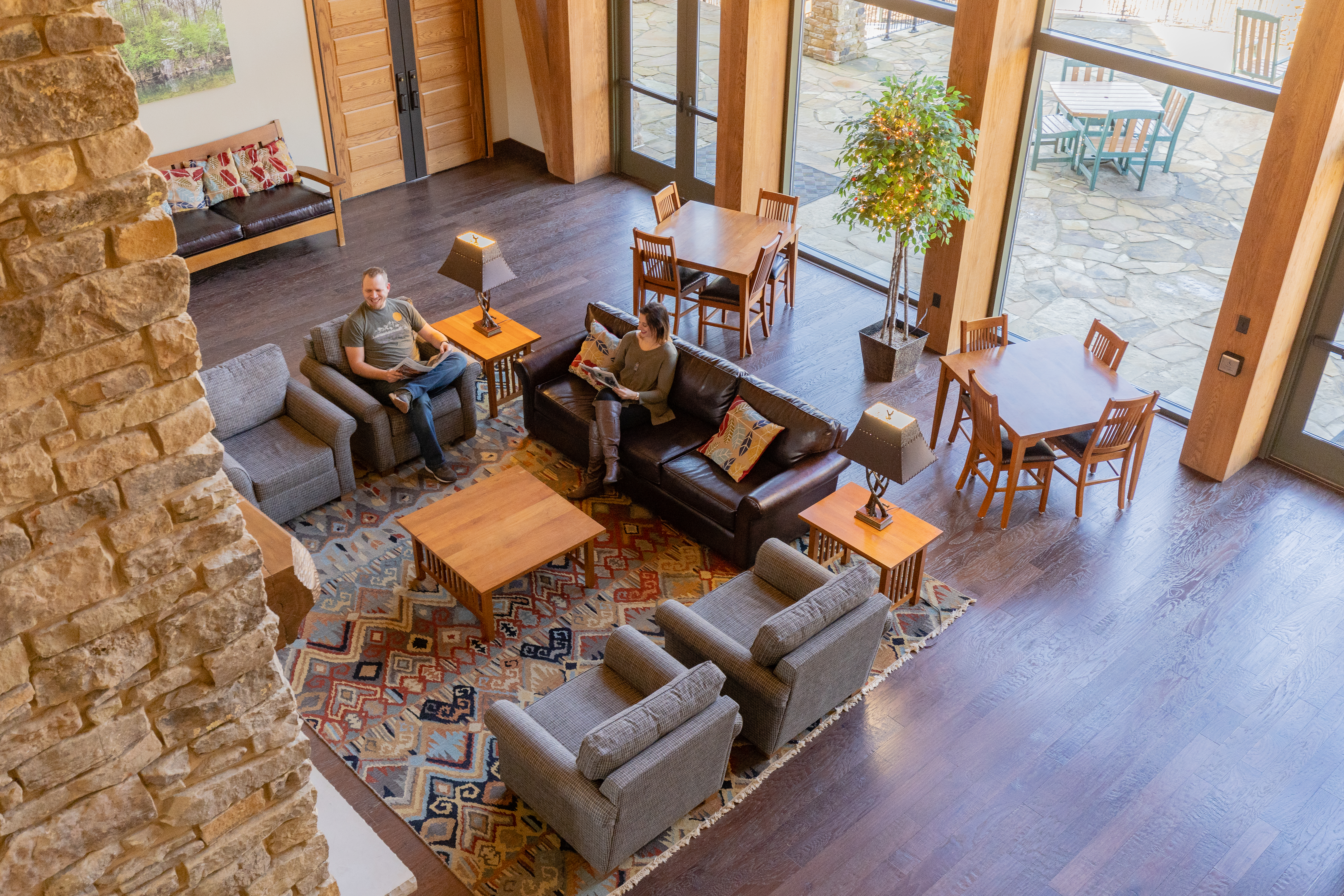 two people sitting in a lounge area