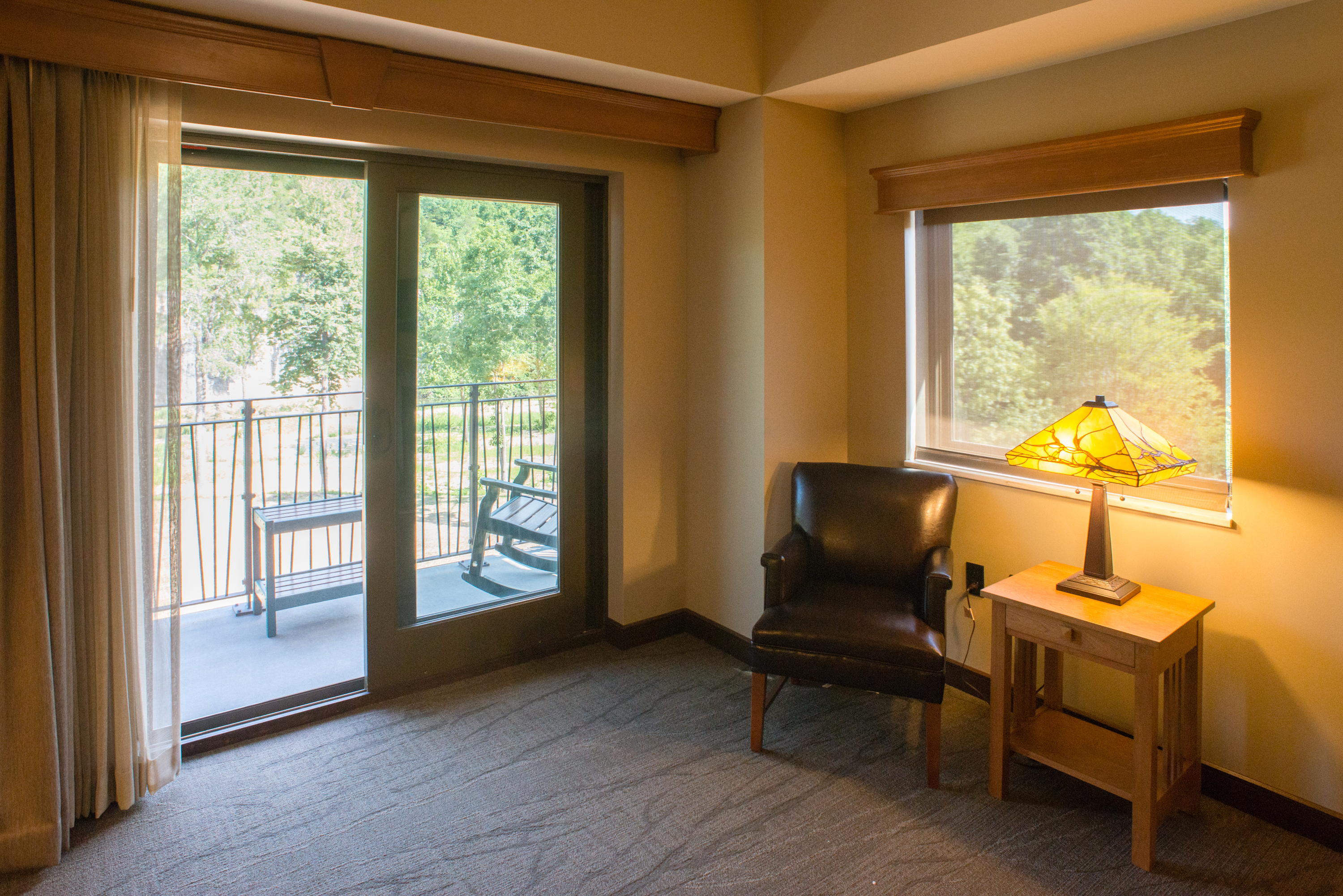 Sitting room with a sliding door leading to a wooden deck
