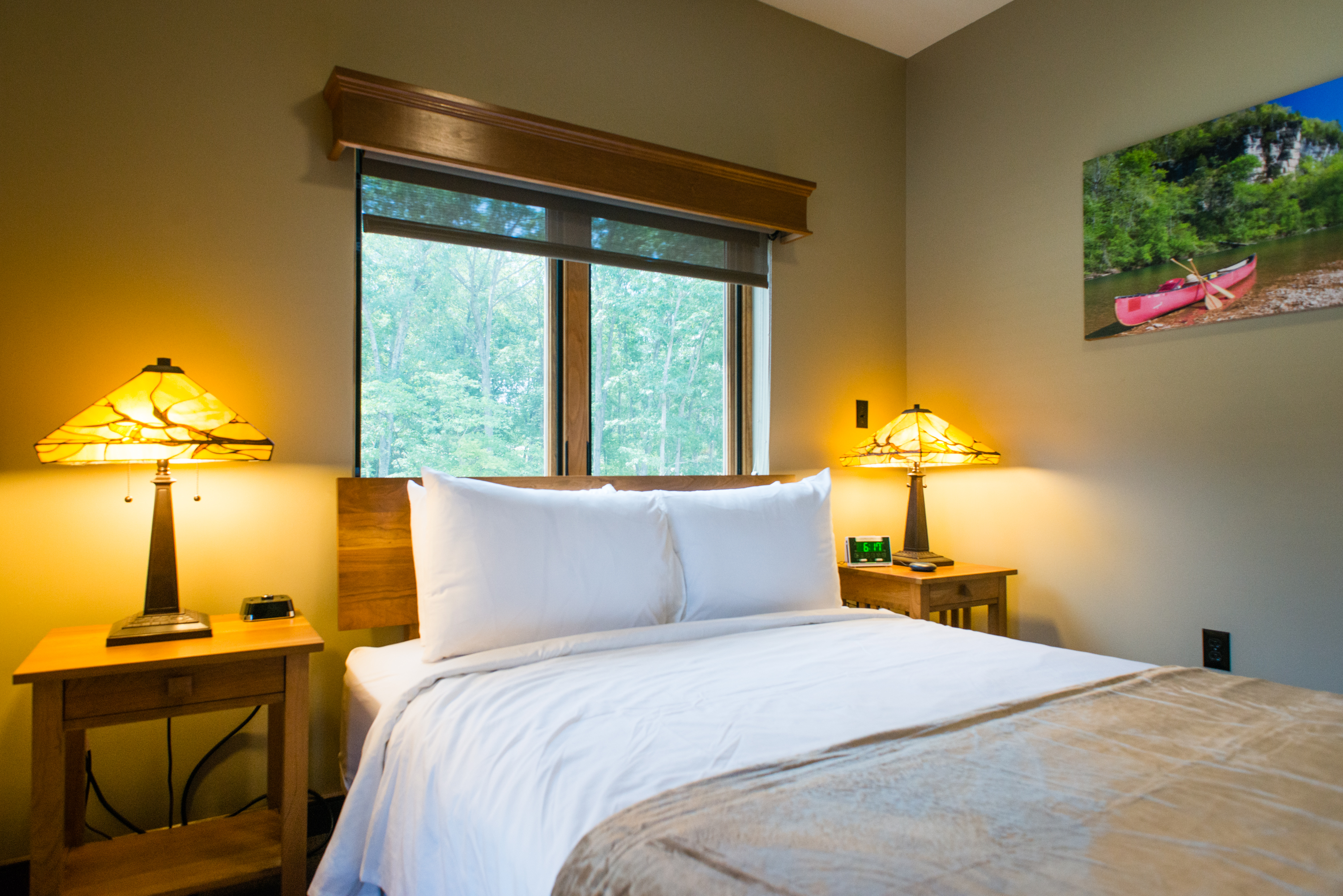 a bed with nightstands on each side