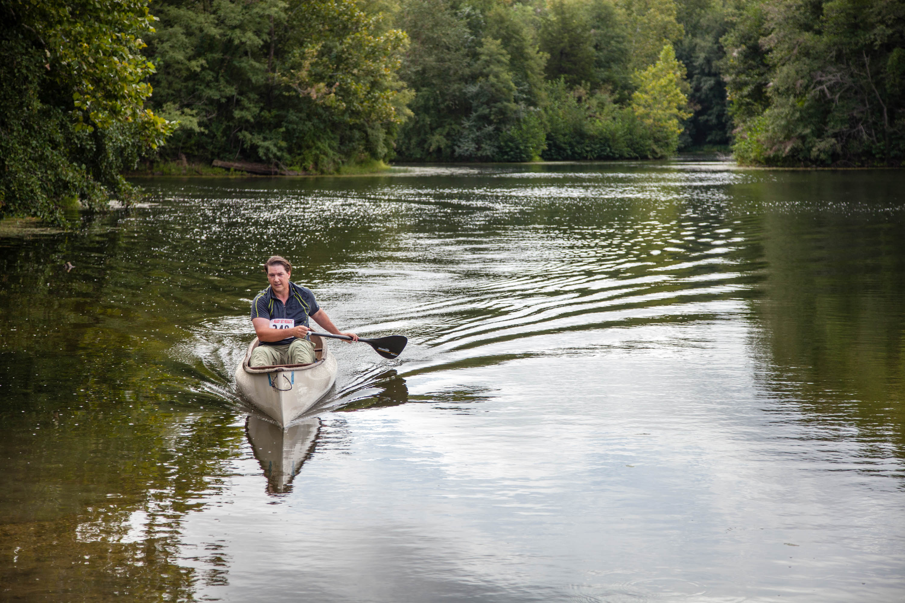A person kayaking on a lake