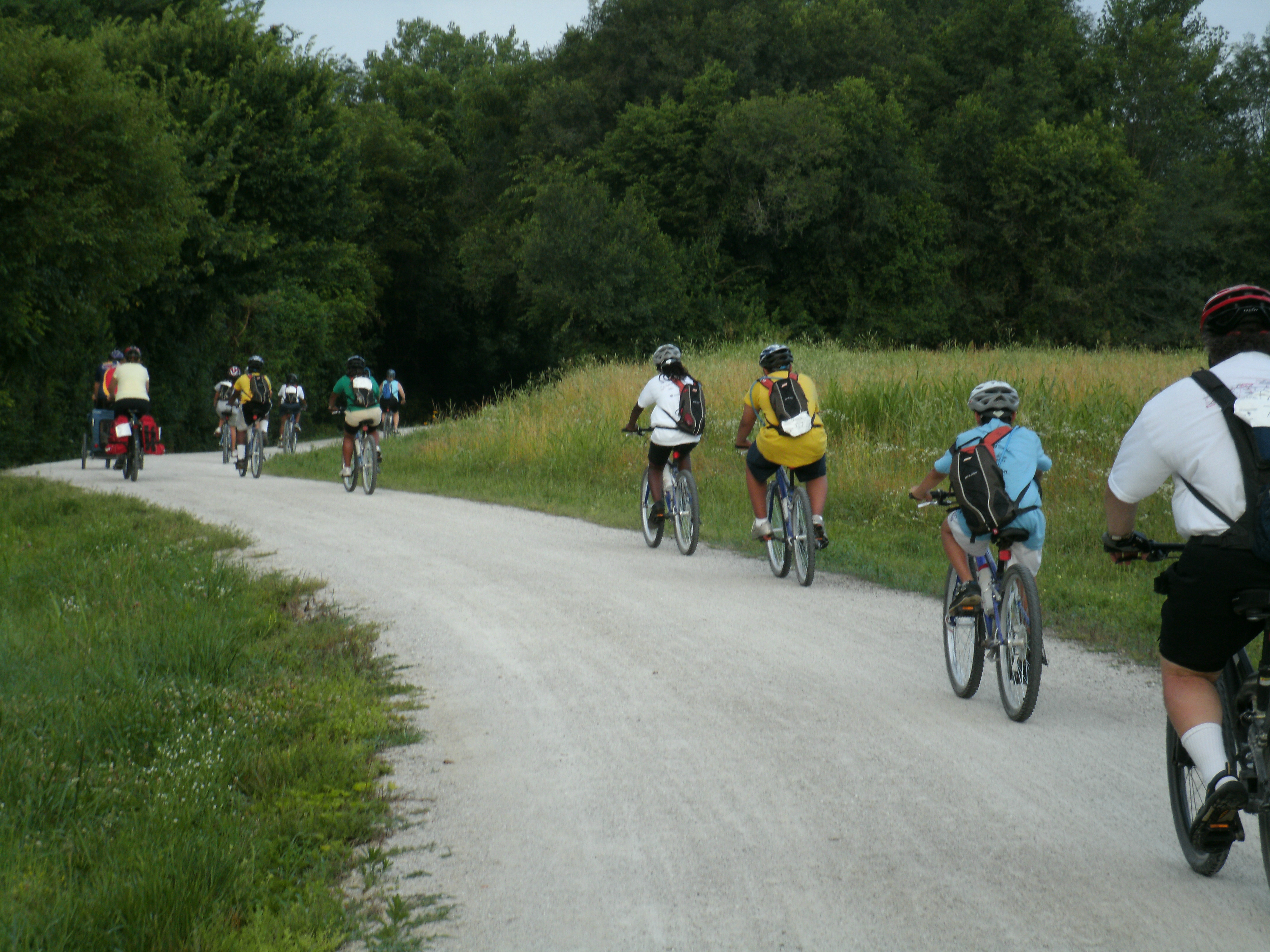 People biking down a trail