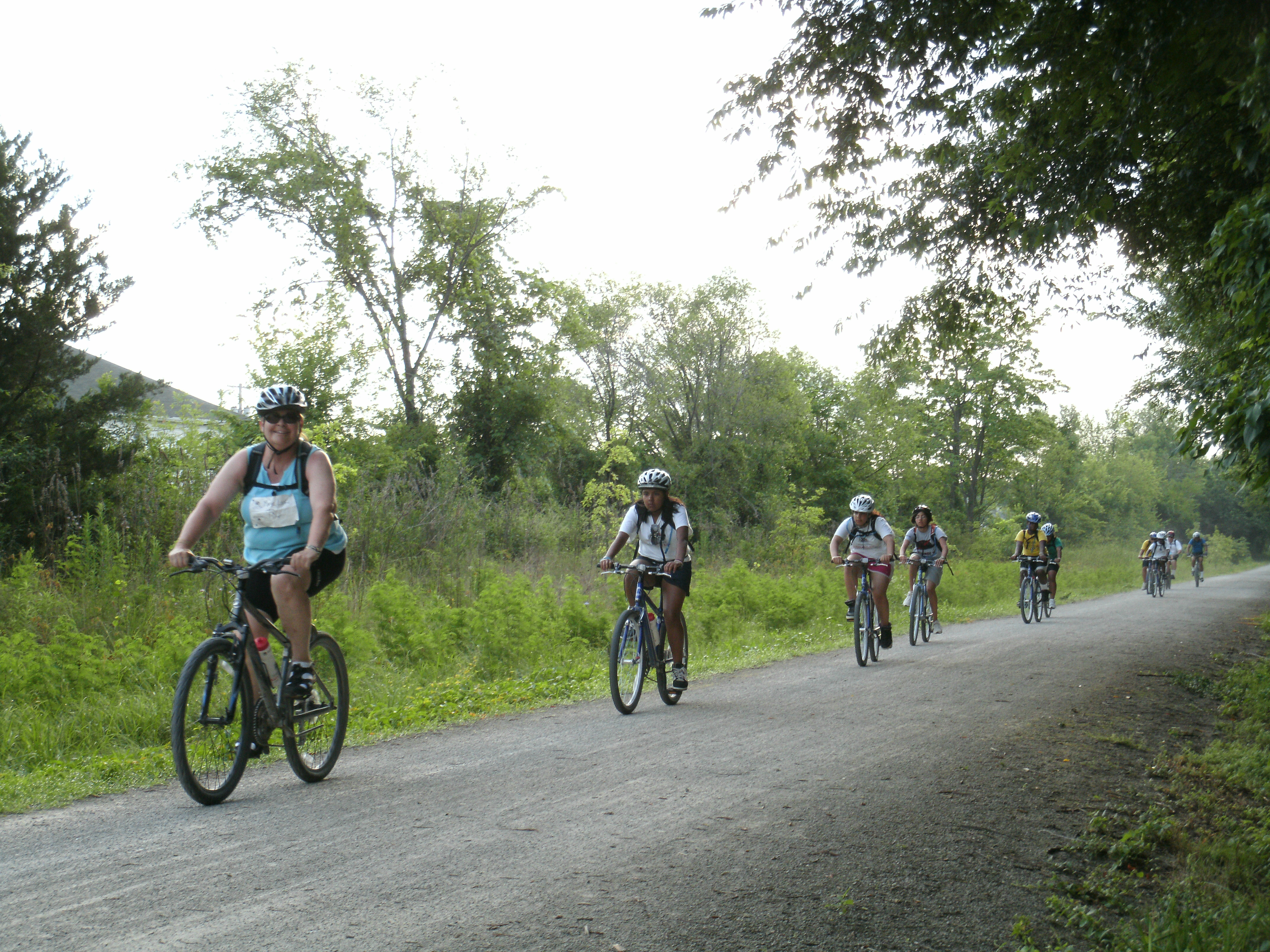 People biking down a trail