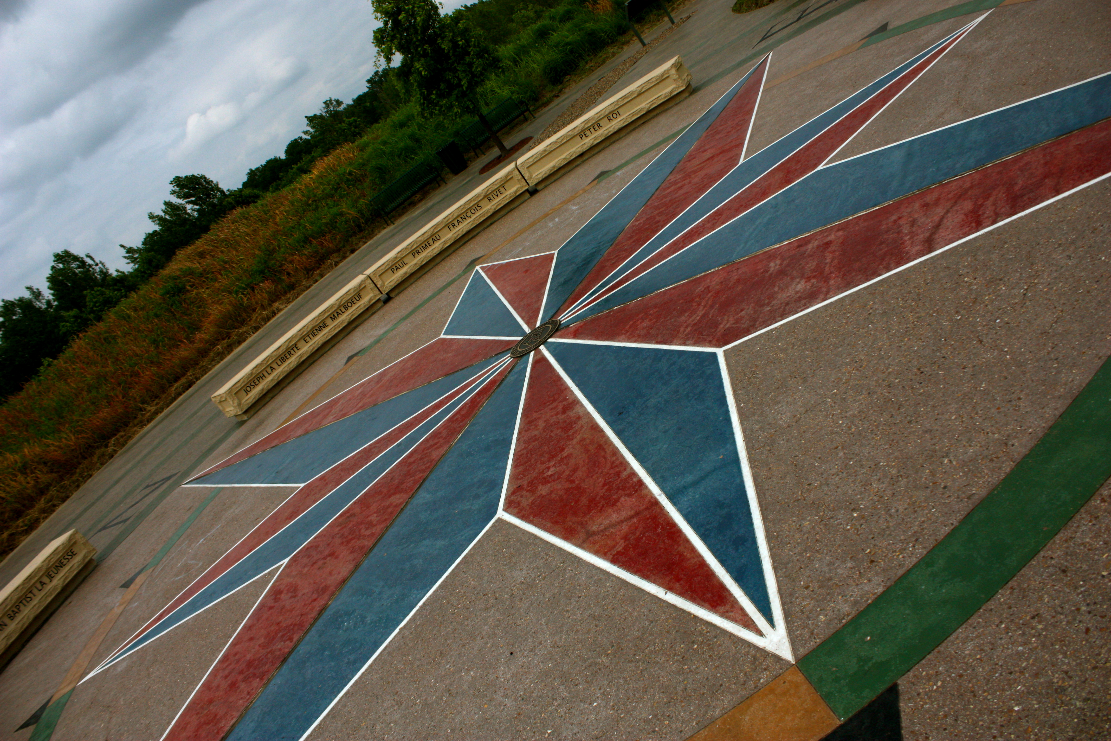 A mural of a blue and red compass rose