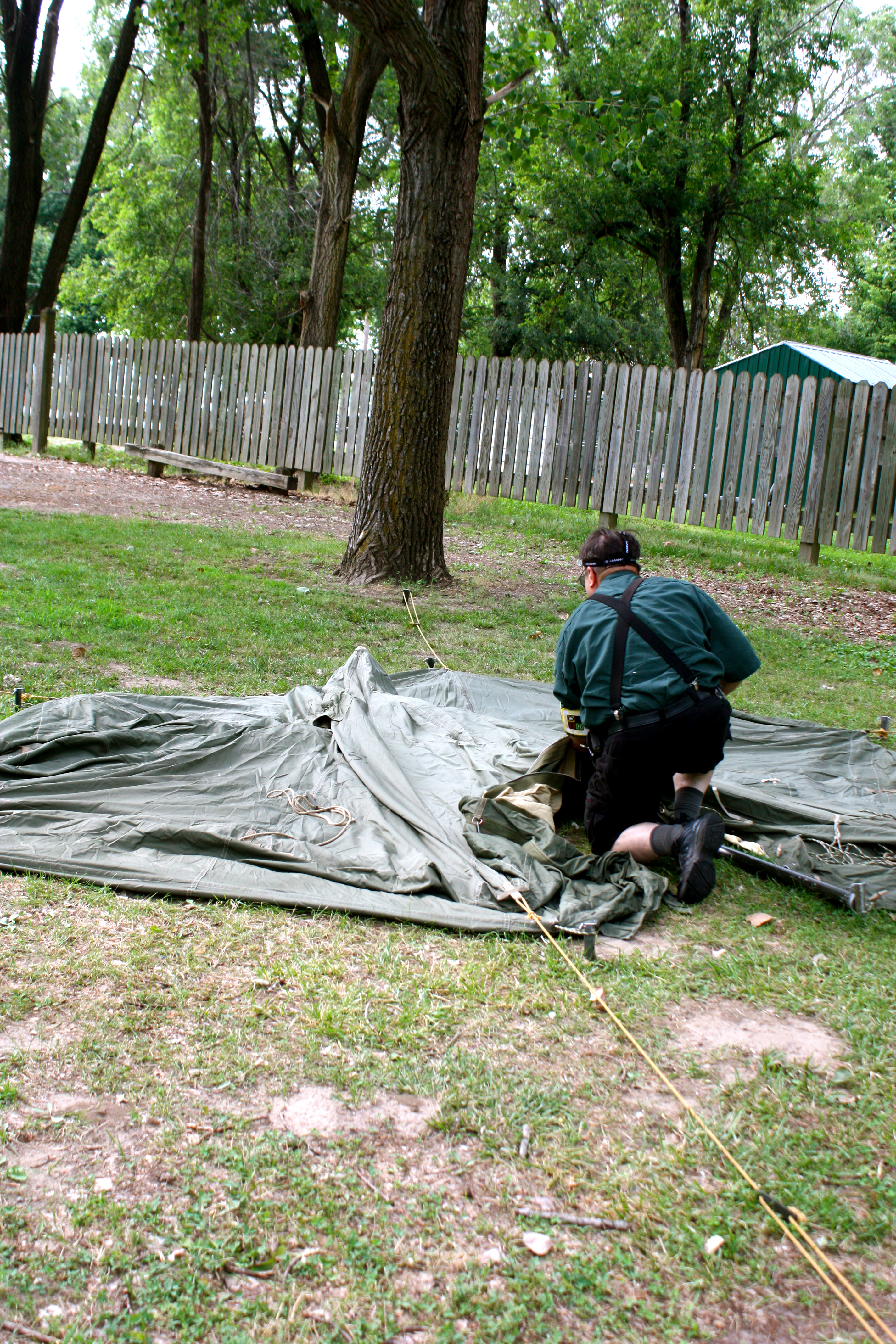 A person setting up a tent