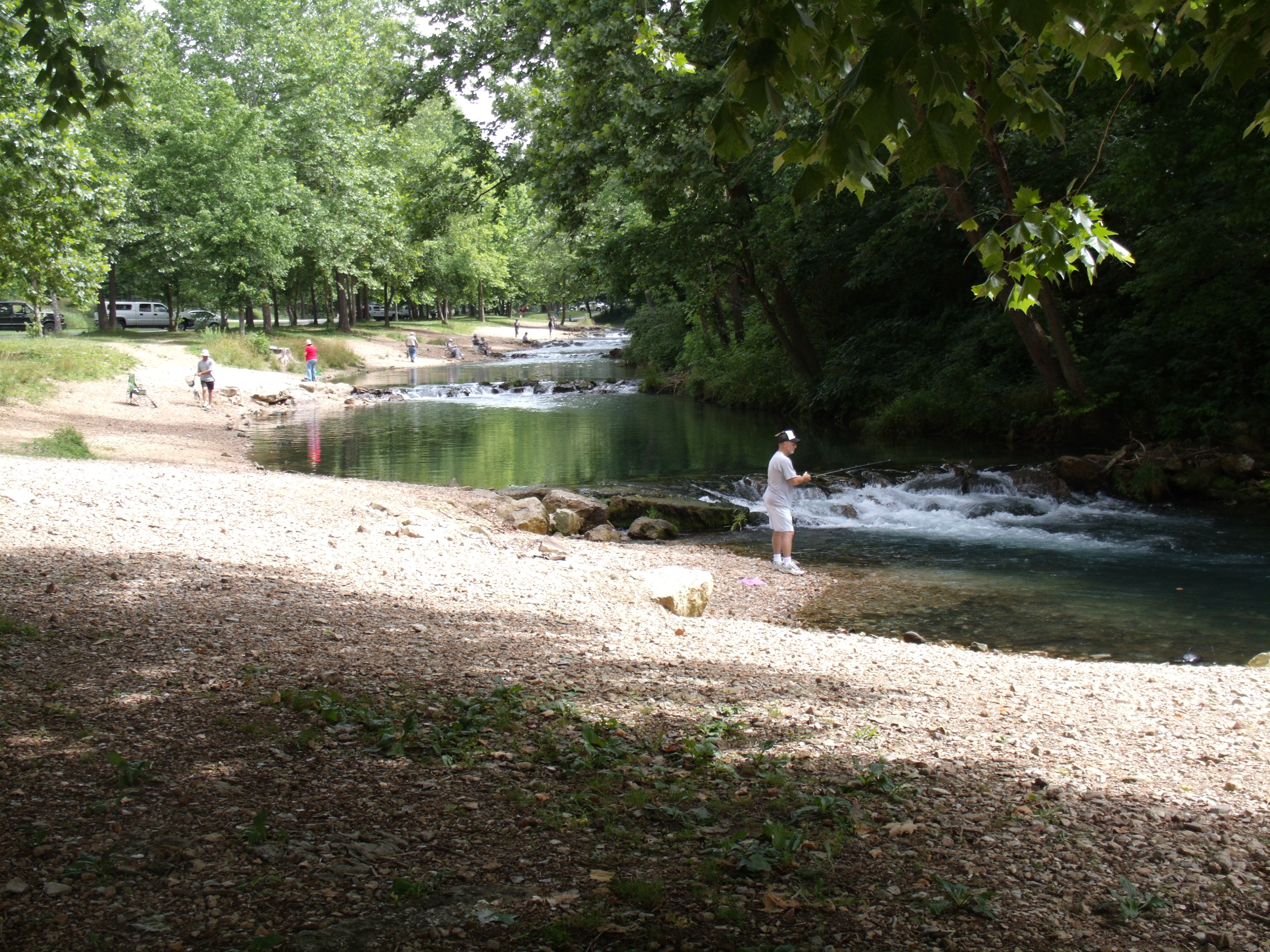a river with people fishing