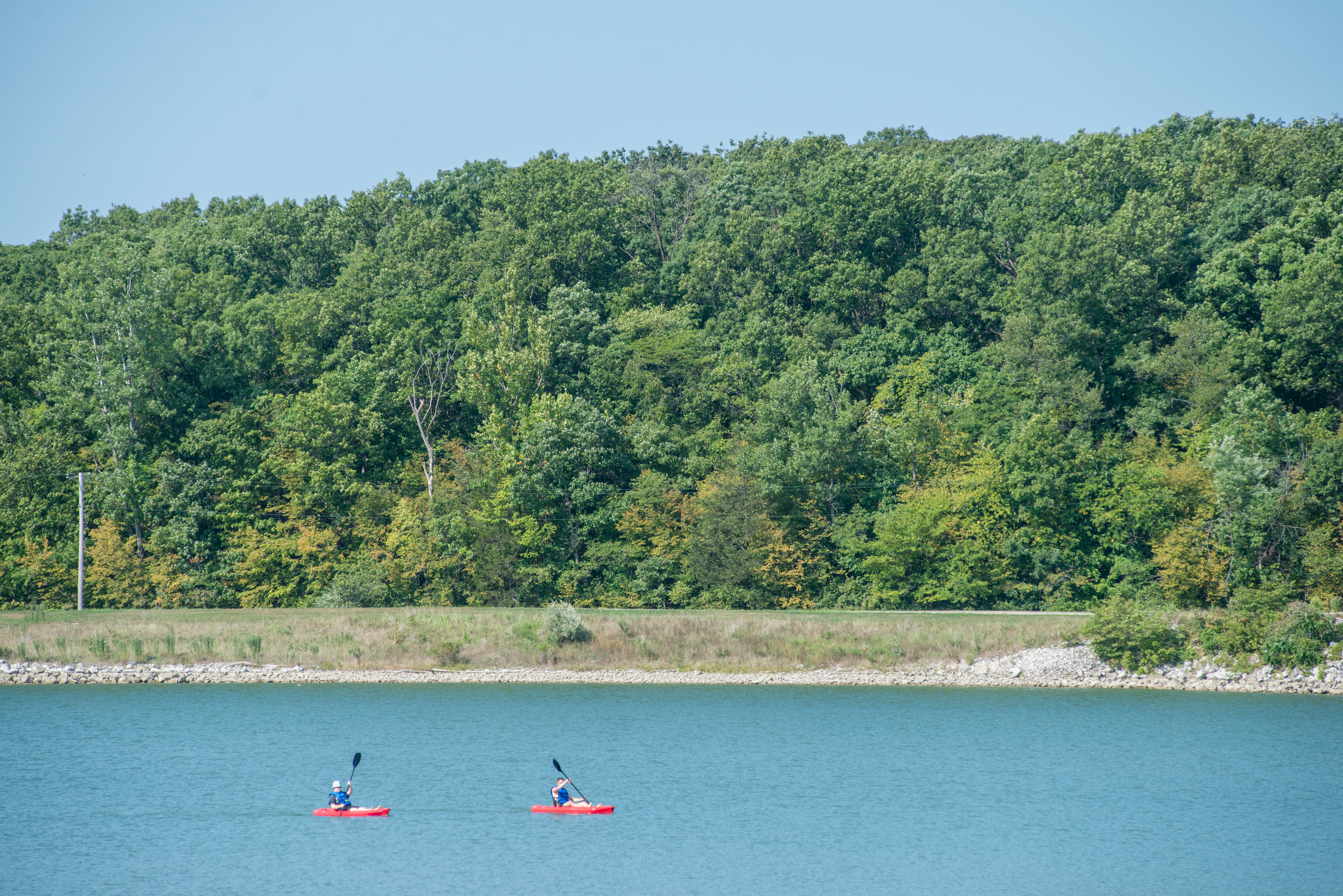 People kayaking in the distance