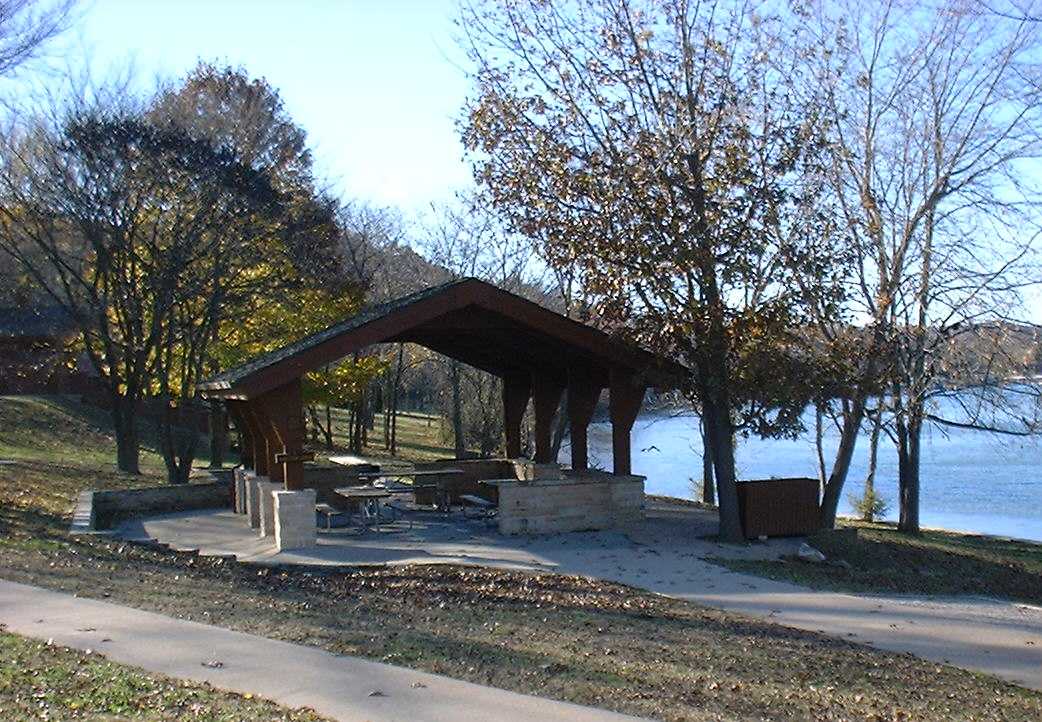 A picnic table under a pavilion