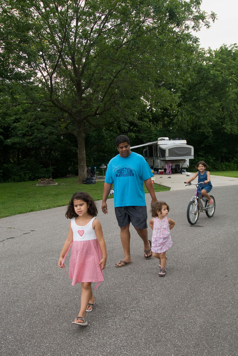 A family walking on a paved road