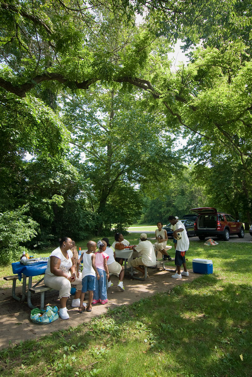 A family talking at a picnic table