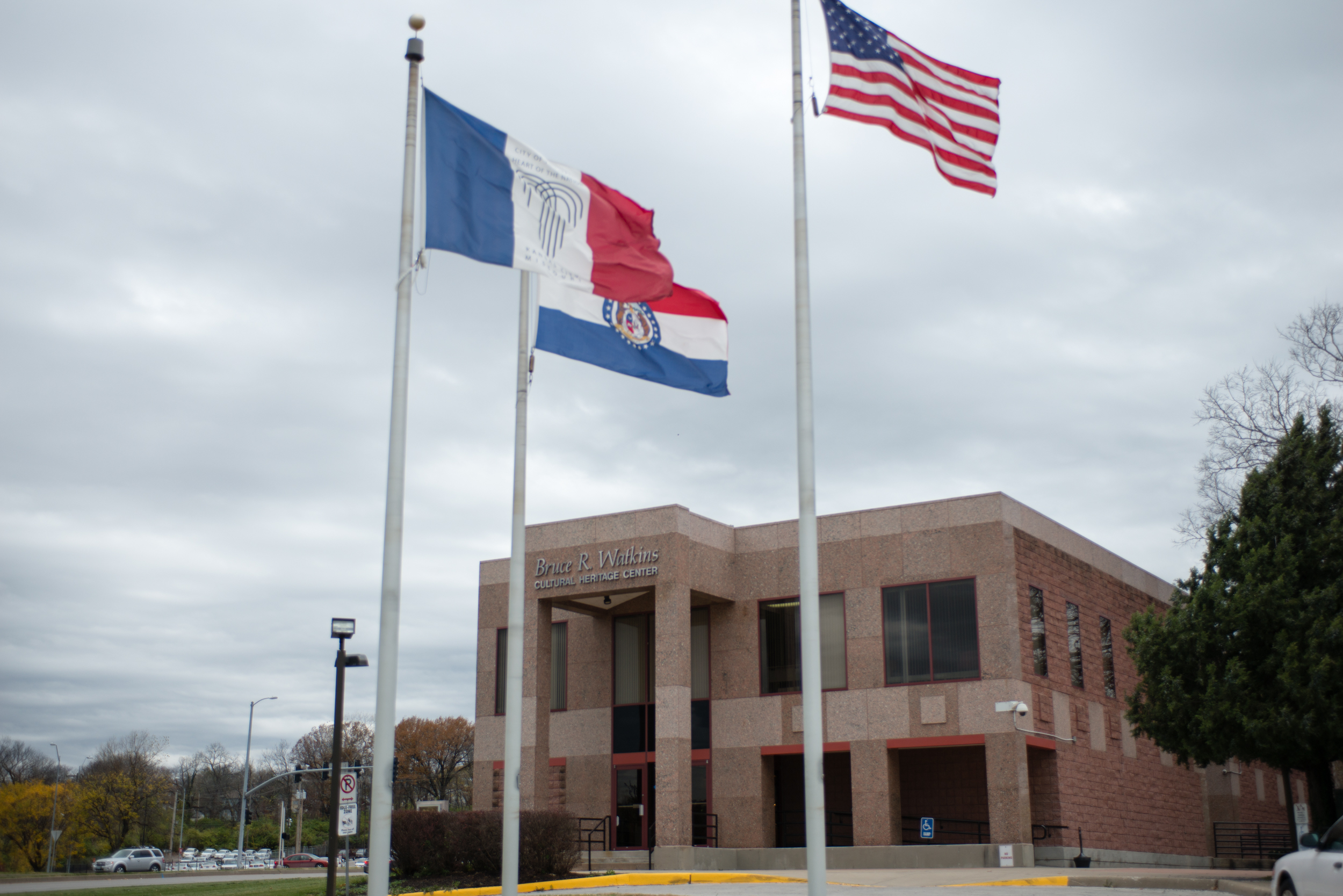 Outside of the Bruce R. Watkins Historical Culture Center with the Kansas City, Missouri, and United States flags on display