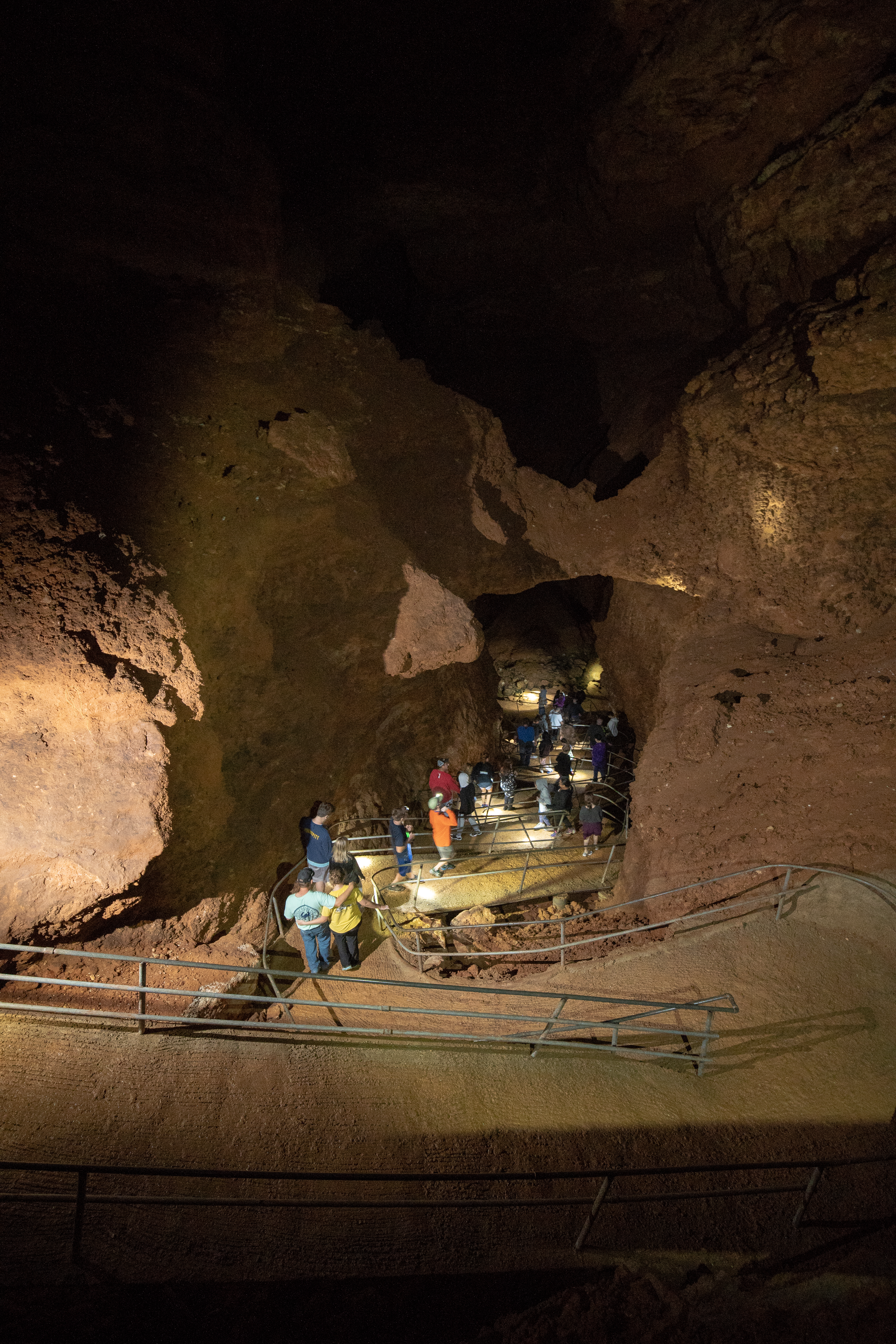 People descending into a cave
