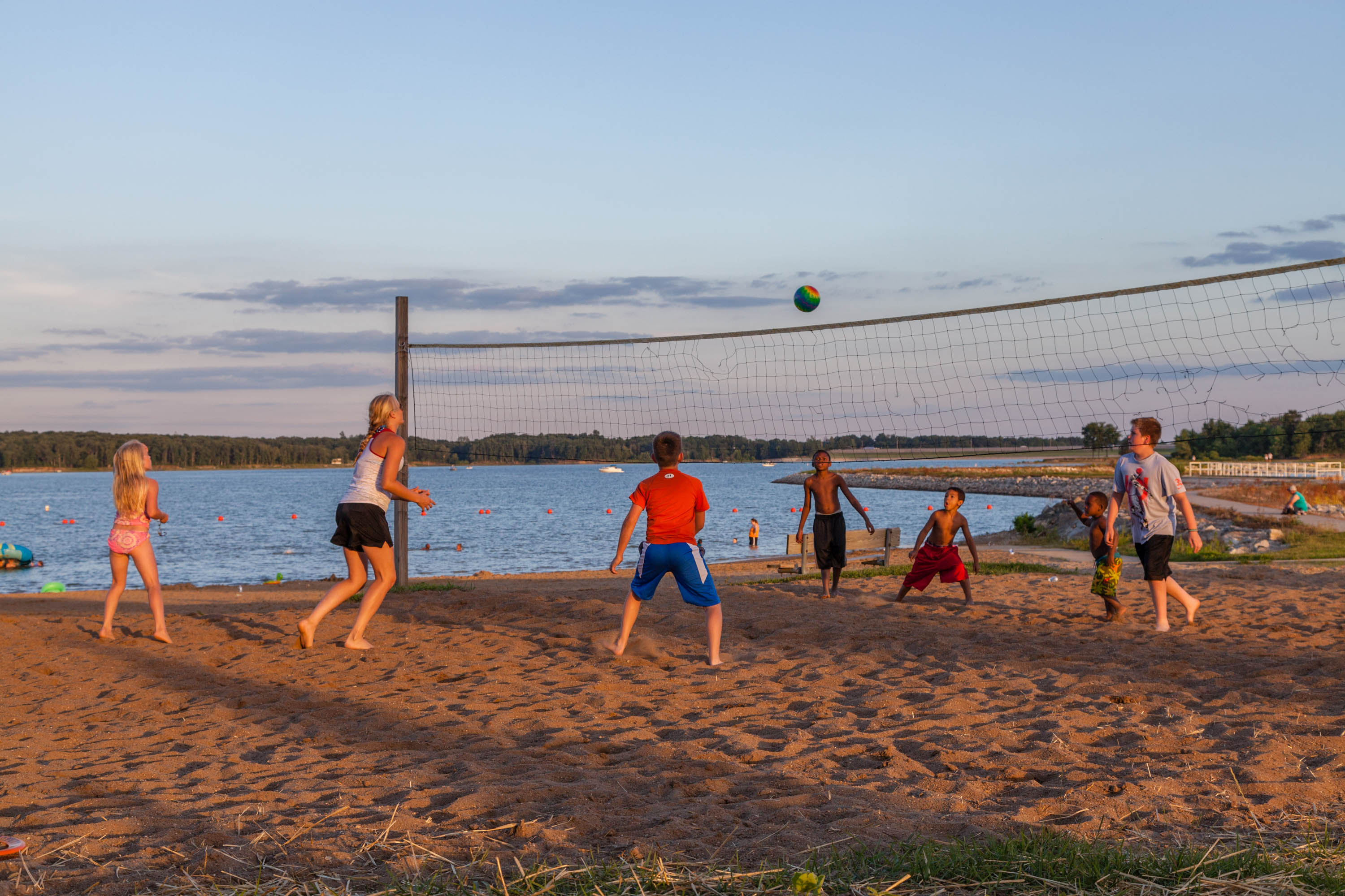Kids playing volley ball on the beach