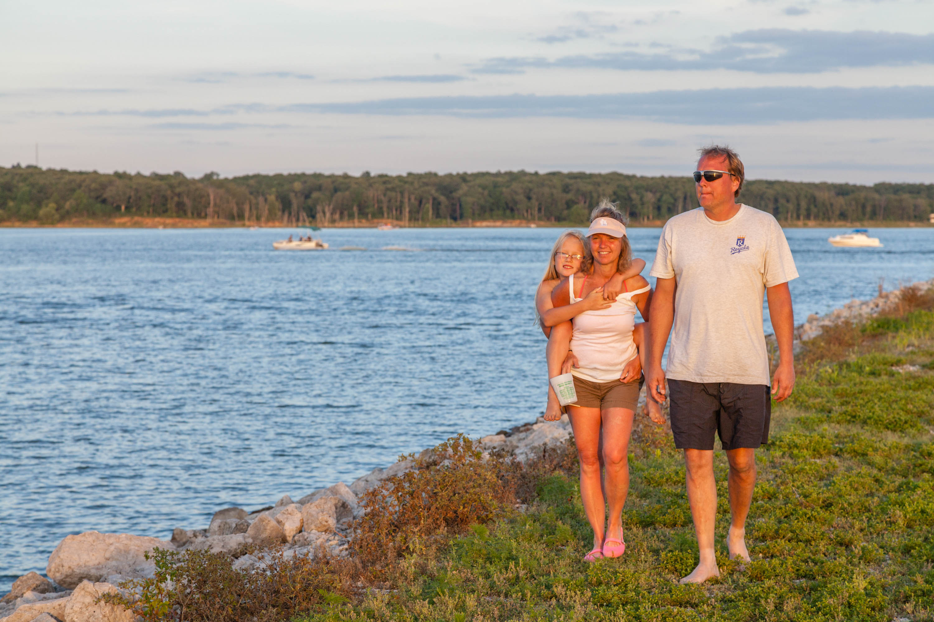 People walking along the water's edge
