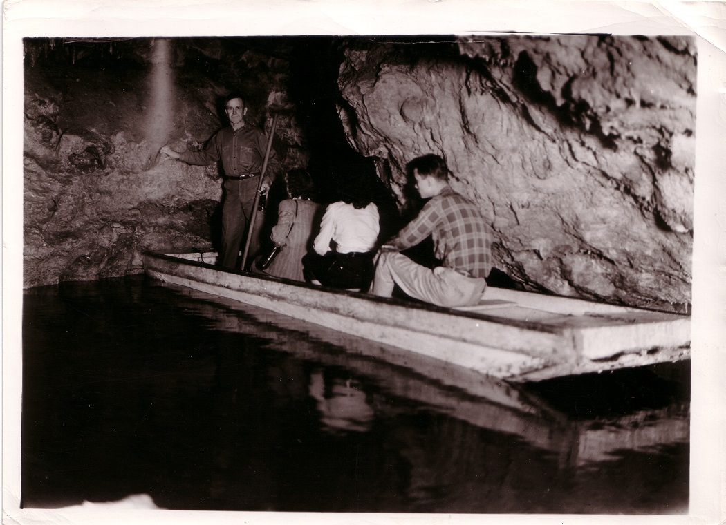 People on a boat in a cave