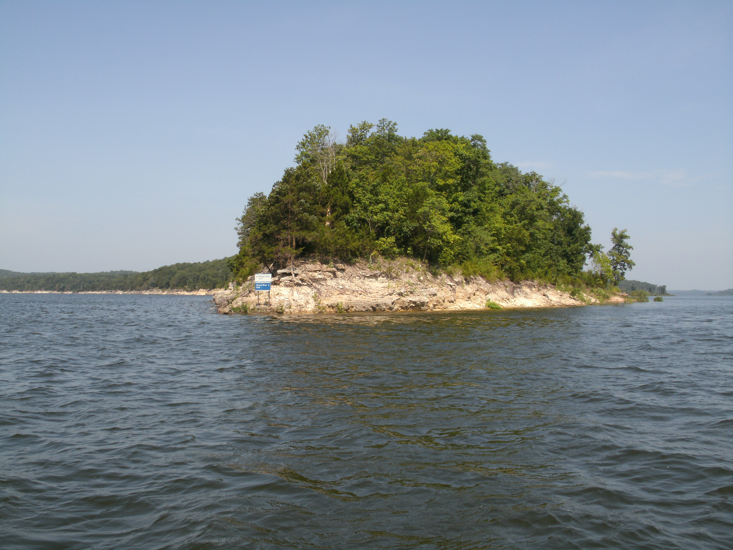 A rocky shore next to a lake
