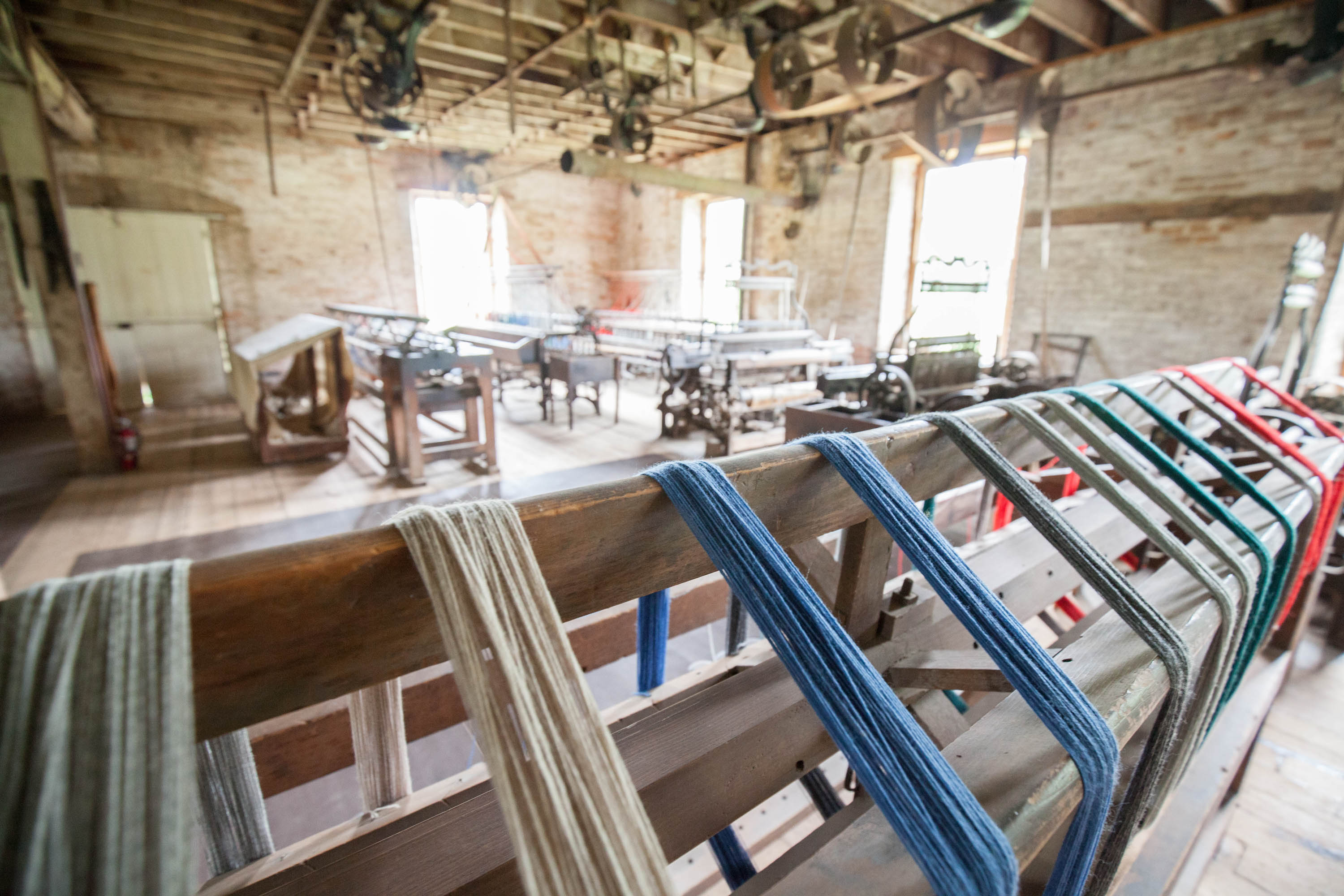 Dyed wool drying on a rack