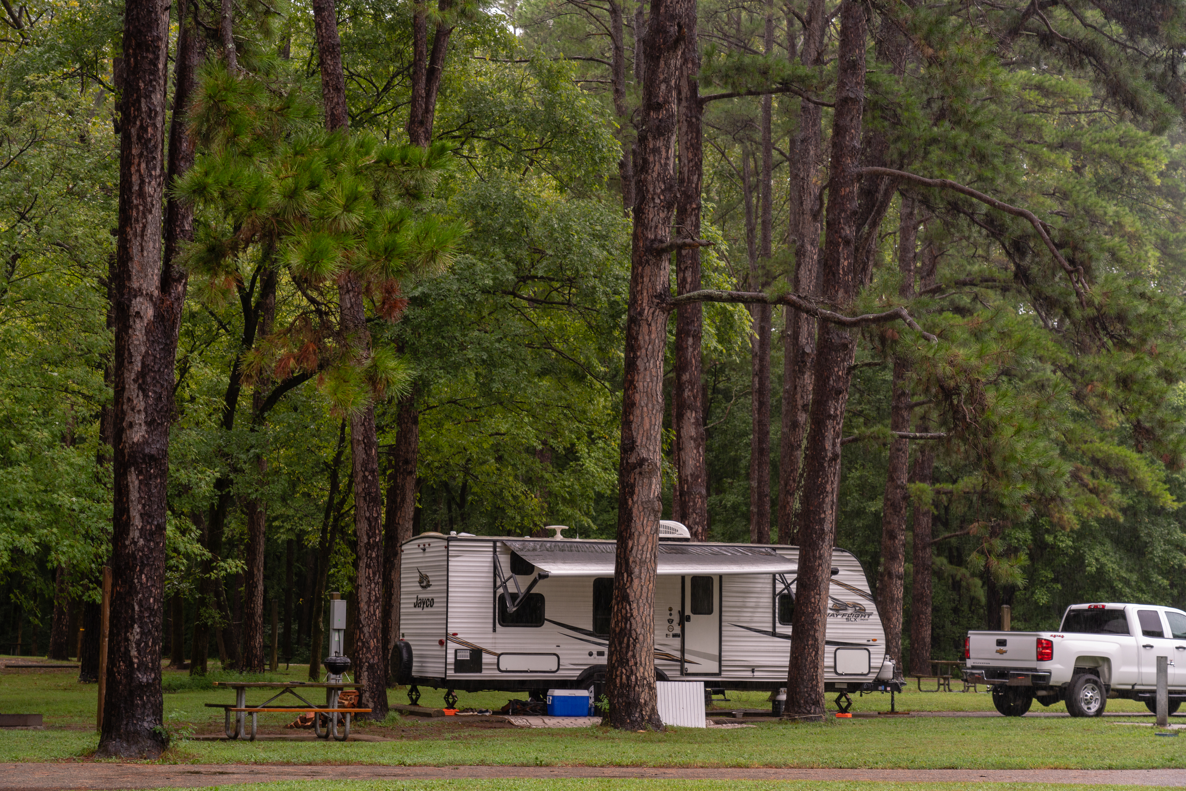 Camper set up in the trees at the campground.