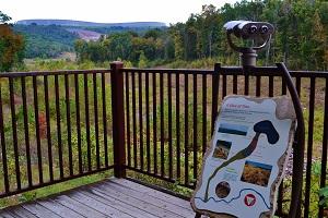 A scenic view with binoculars on a walking trail