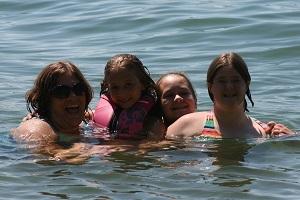 a family posing in the water