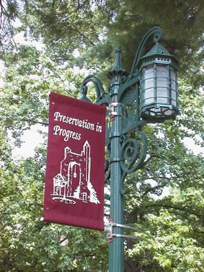 "Preservation in Progress" banner on lamppost 