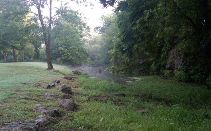 The end of a river on a foggy morning