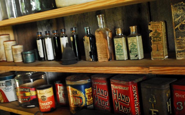 A shelf with display of historical products