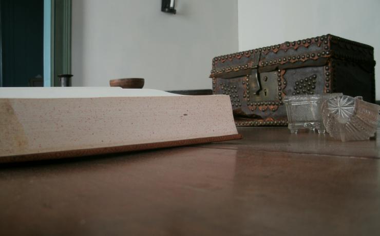 A close-up of an open book on a desk