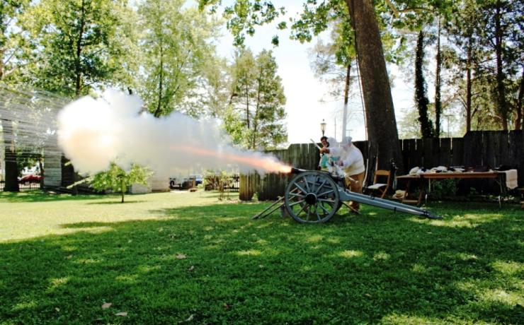 Re-enactors setting off a cannon