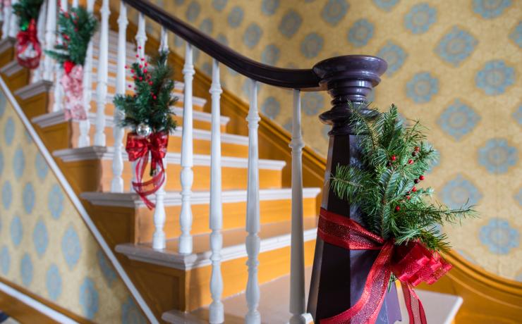 A staircase decorated for christmas