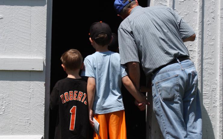 A group looking through a door