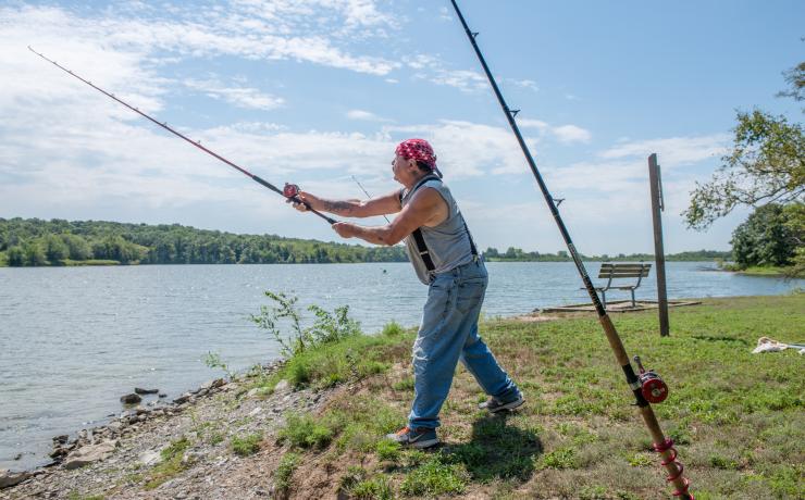 People fishing on a river
