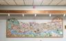 A mural depicting animals, plants and a river