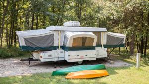 an RV camper at a campsite at Park Cuivre