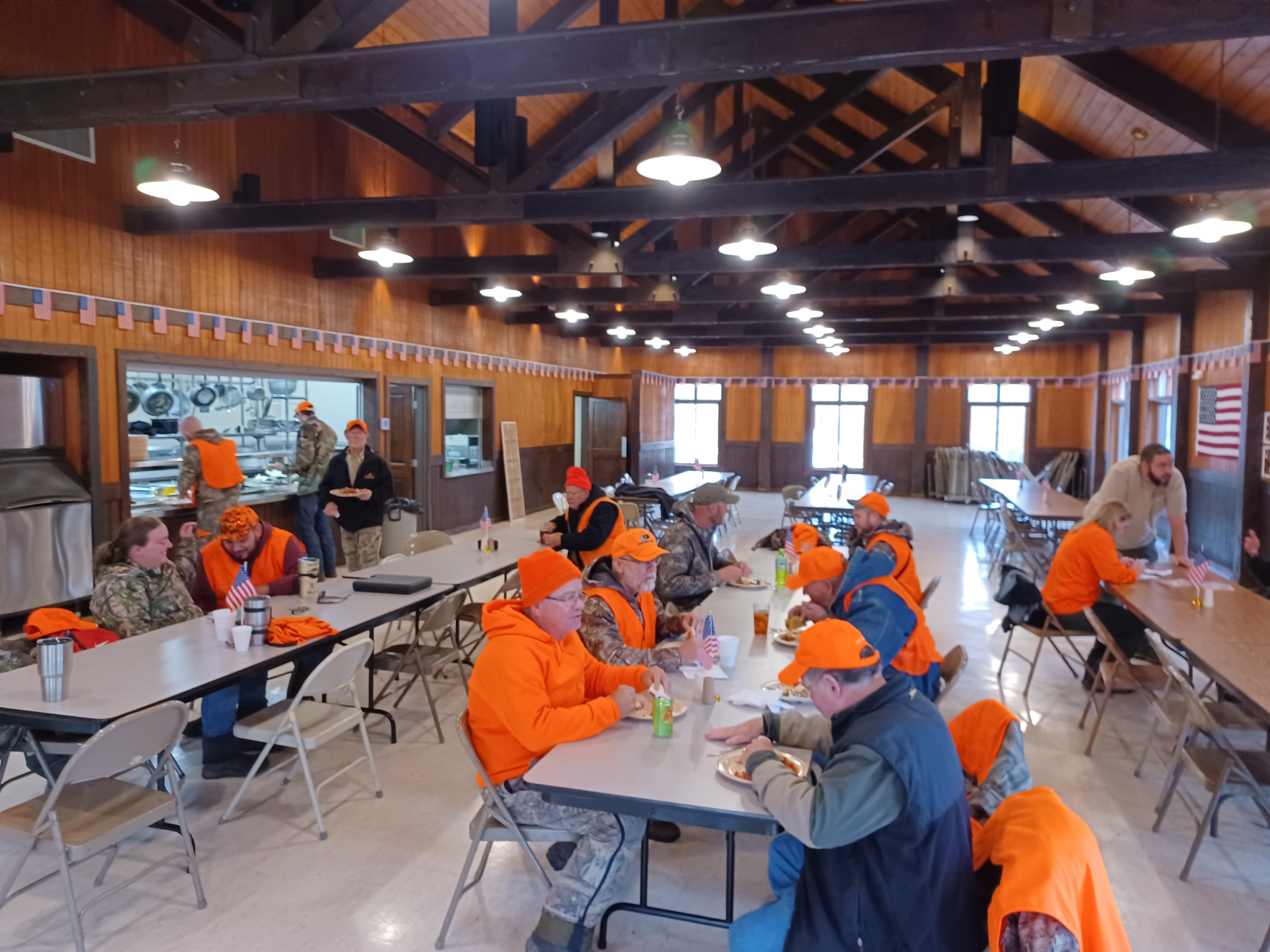 Veterans, staff and volunteers share a meal inside during the 2022 hunt.