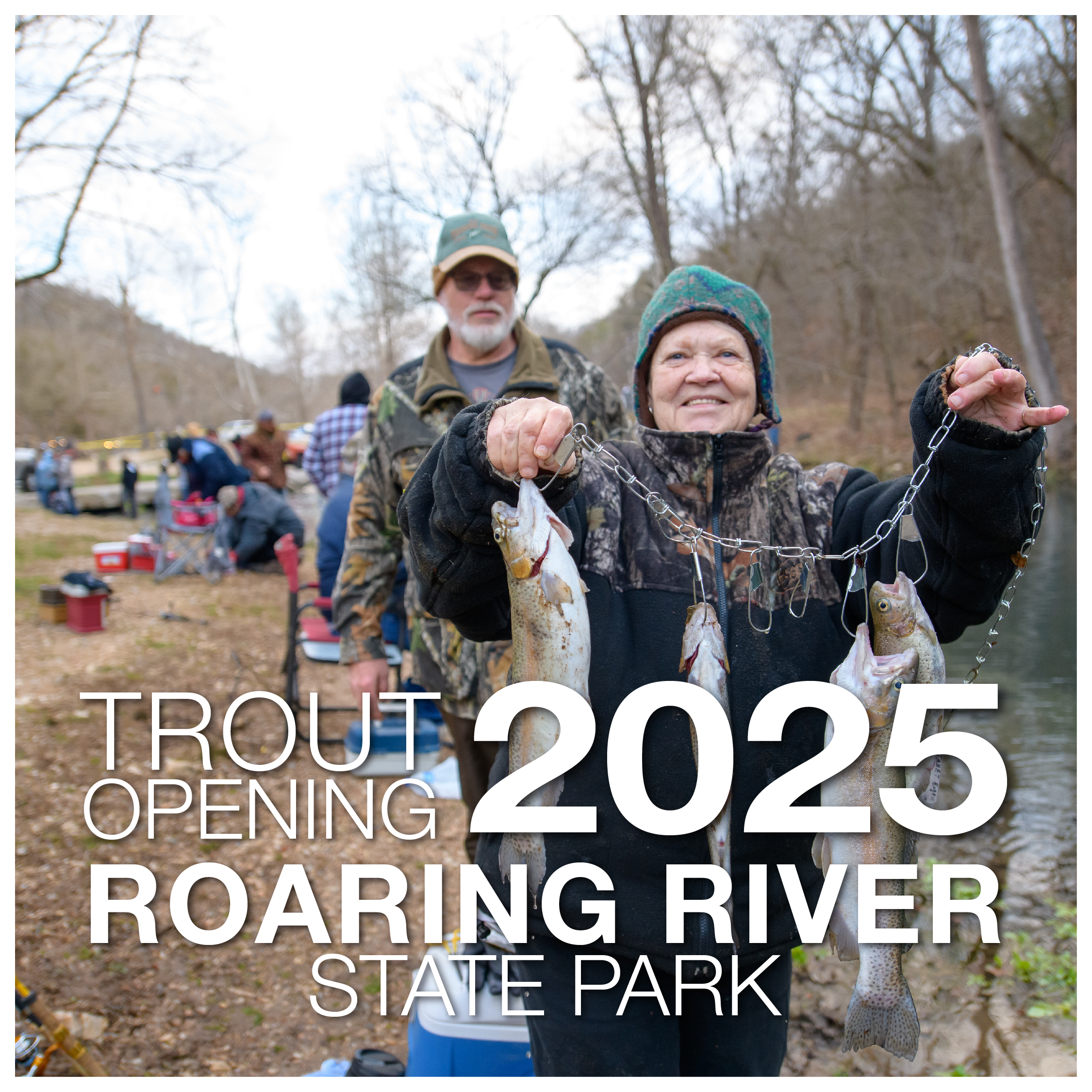 Person holding up their trout line with three trout.