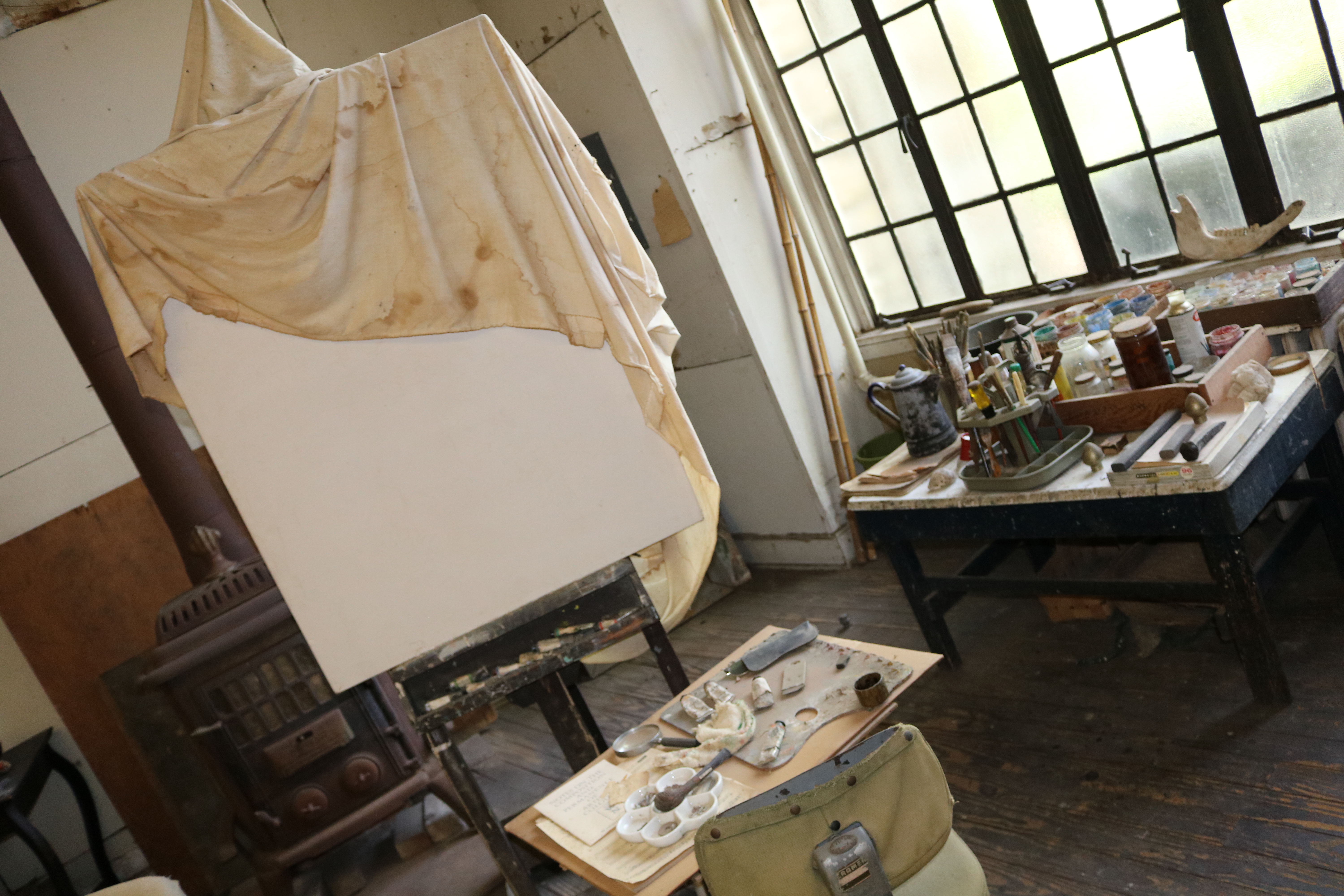 paint canvas and paints inside Benton's studio
